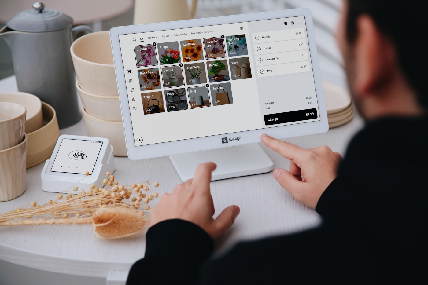 Customer using a shared tablet at a retail counter
